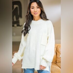 New high-neck cream sweater